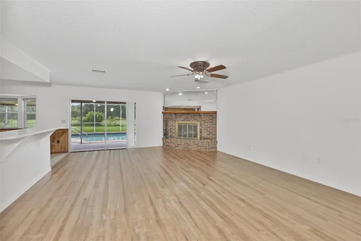 Open floor plan invites you into the home, with a view right onto the pool and acreage.