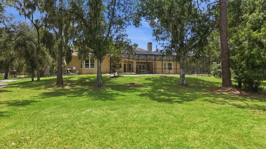 Open lawn with mature oak trees and room for horses
