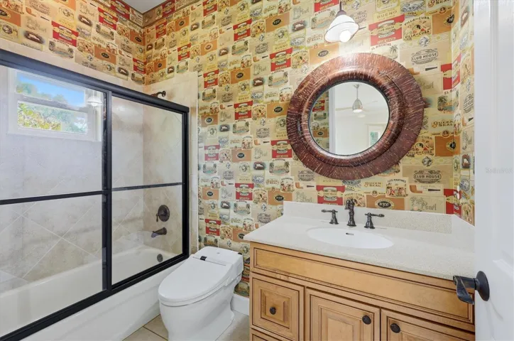 Guest bathroom with custom vanity and tiled shower