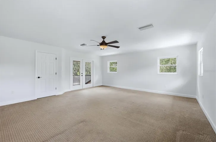 Spacious upstairs bonus room/bed room with multiple windows