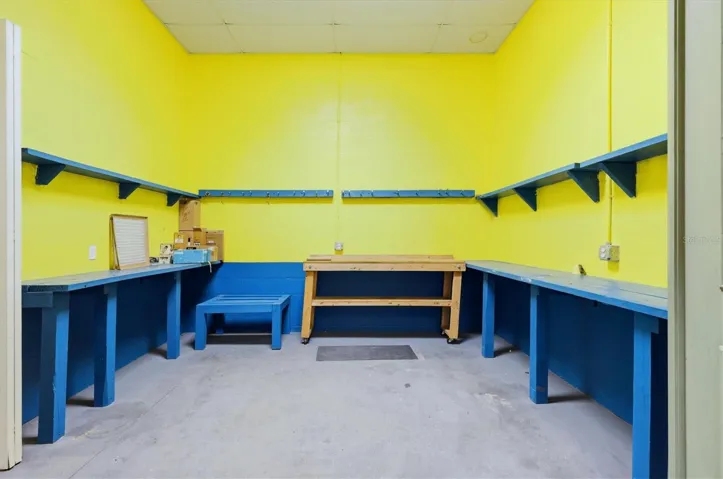 Dedicated workshop room with built-in workbenches