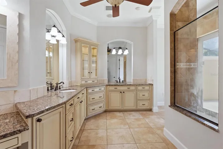 Luxury primary bathroom with dual vanities