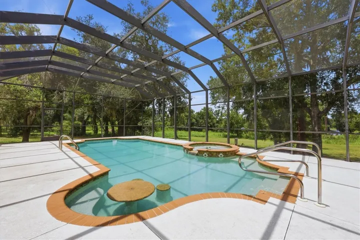 Private pool and spa within a large screened enclosure