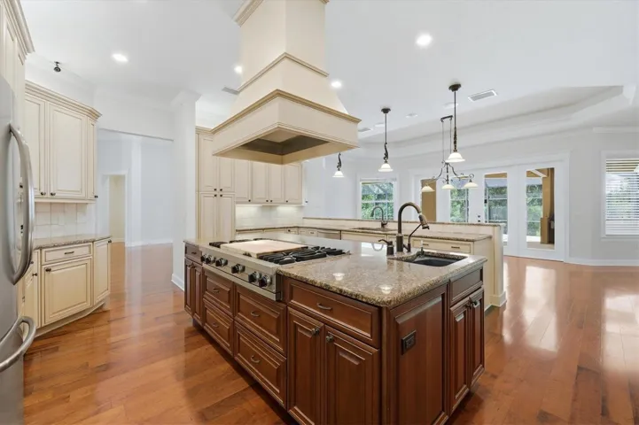 Gourmet kitchen with island and custom cabinetry