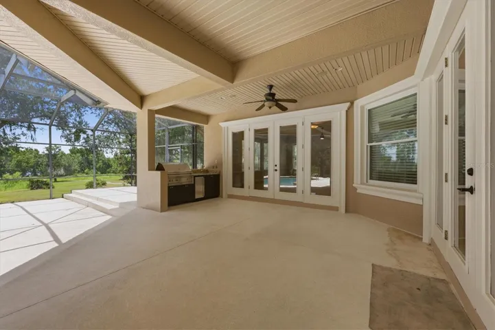 Spacious outdoor living area overlooking the pool