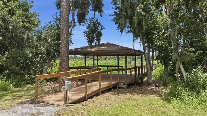 Covered Lake Manatee dock surrounded by natural scenery