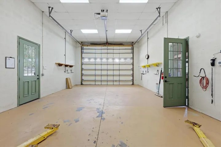 Oversized garage with tall roll-up door and RV hookup