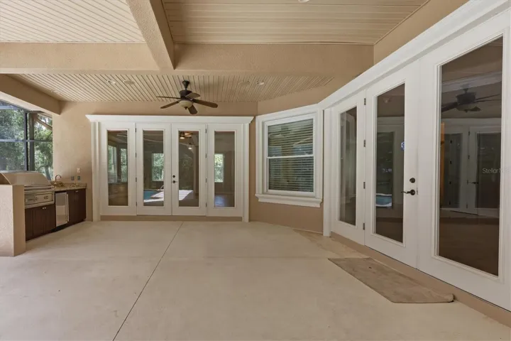 Expansive covered lanai with multiple access doors