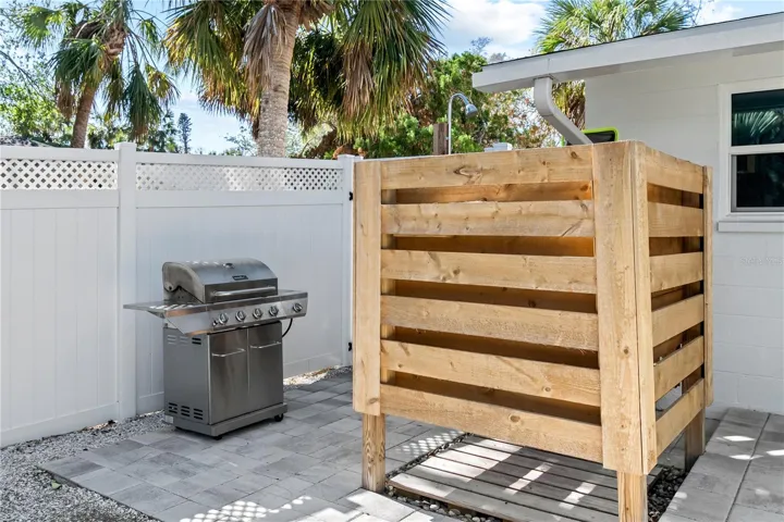 Outdoor shower and grill area