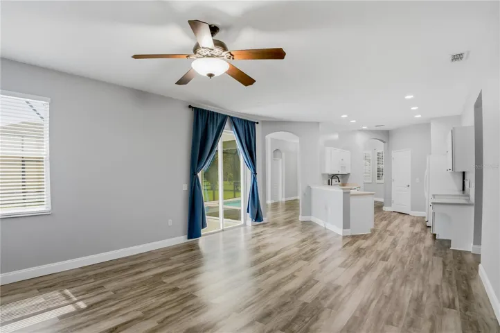 FAMILY ROOM LOOKING BACK INTO KITCHEN AND LIVING ROOM ENTRANCE