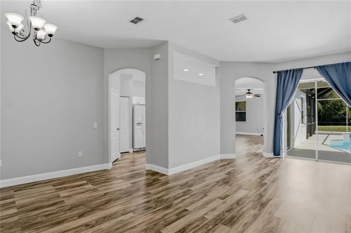 VIEW FROM FOYER-LIVING ROOM TO RIGHT DINING ROOM TO LEFT AND KITCHEN ENTRANCE