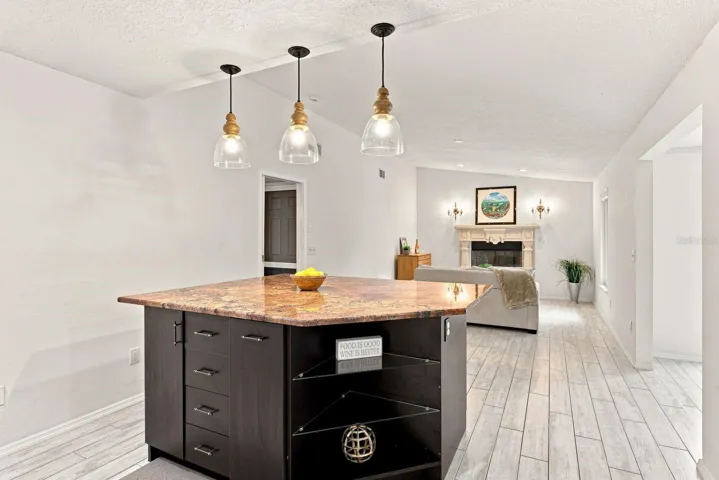 Massive Kitchen Island w/ built in shelving and trash can