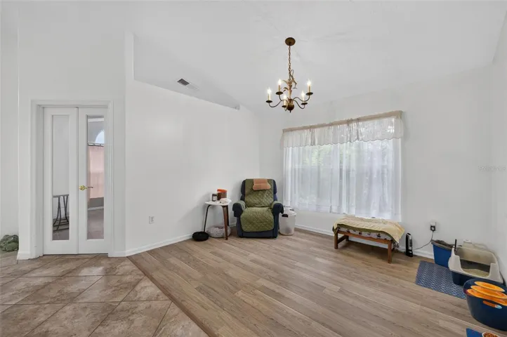 Formal dining or additional living space, reading nook, media room, right next to office, fresh paint and natural light, new flooring