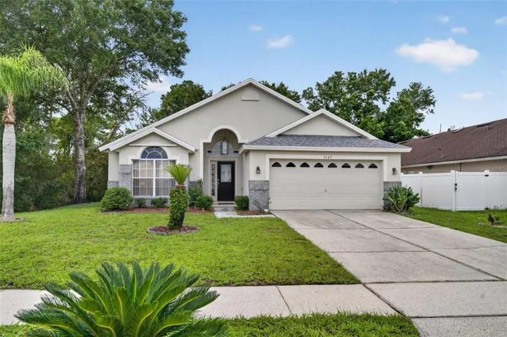 Curb appeal of Arbor Ridge Deltona Listing 3/2 for sale with an office and hot tub