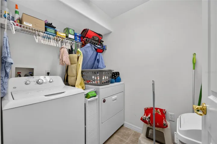 Spacious laundry room right off garage with fully functioning washer and dryer