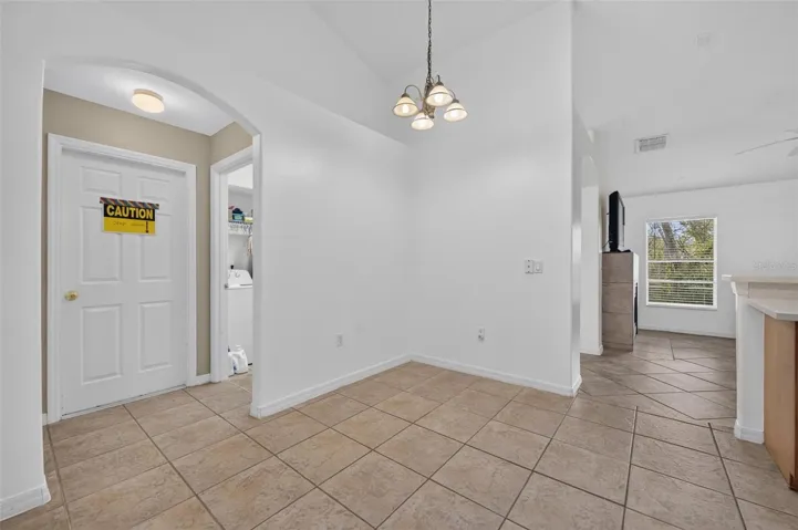 Entrance from garage into living space and kitchen