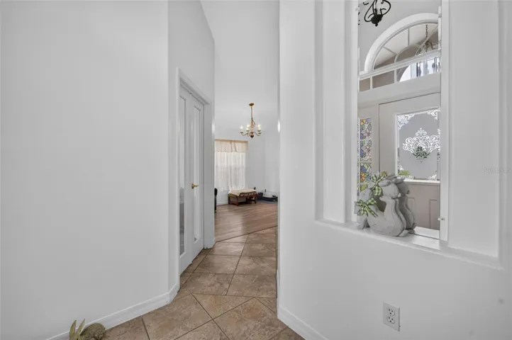 Entrance to your home, front stoop perfect for art and shoe racks. Lovely upgraded vinyl flooring throughout