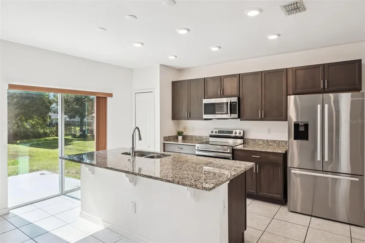 Kitchen with eat in bar area