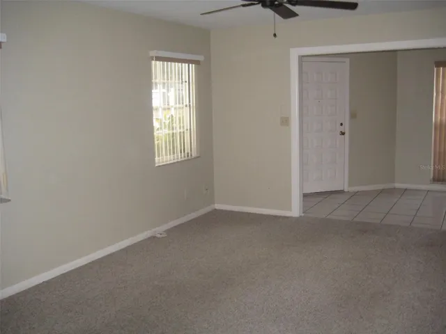 Living room looking toward Florida room and front door.