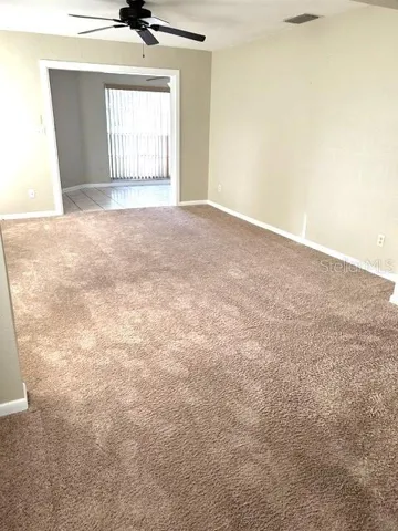Looking from the dining area through living room toward Florida room.
