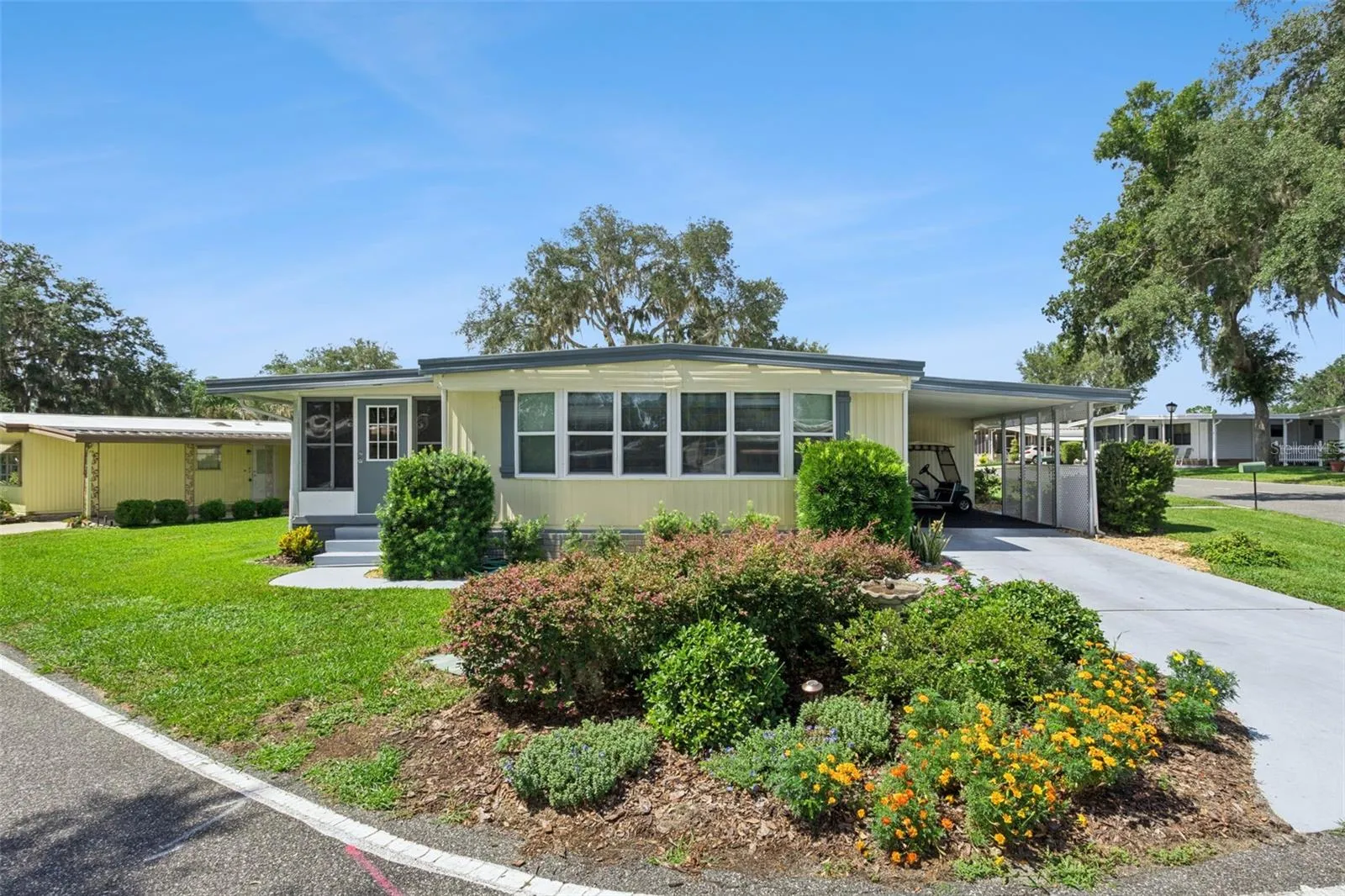 This lovely corner lot is beautifully landscaped with "Florida friendly" plantings.