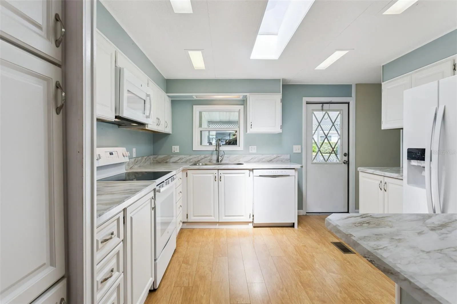 The kitchen also has a SKYLIGHT foe ample natural light.