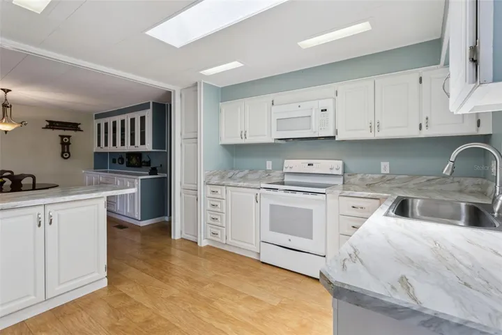 The KITCHEN is equipped with NEWER APPLIANCES and lots of counter &amp; cabinet space