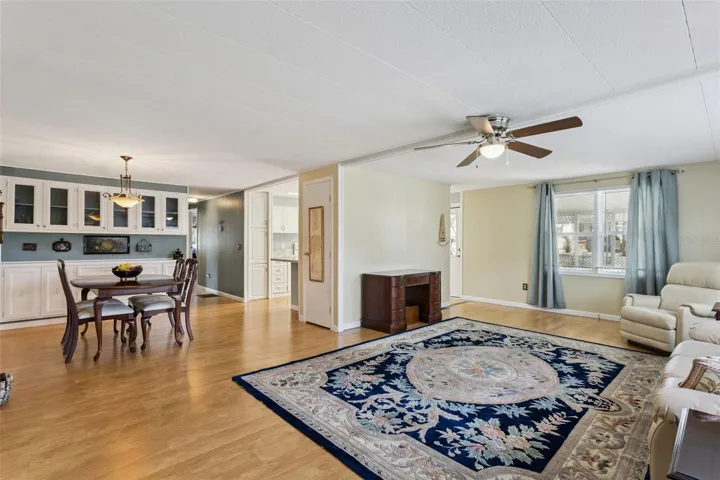 The DINING ROOM is conveniently located at the center of the home and has BUILT-IN CABINETS for storage.