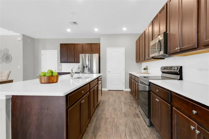 Extra storage space through the kitchen.