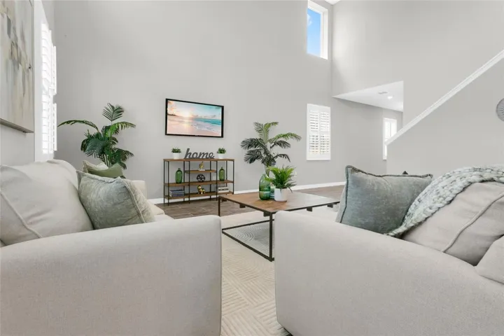 Family Room with natural lighting and plantation shutters.