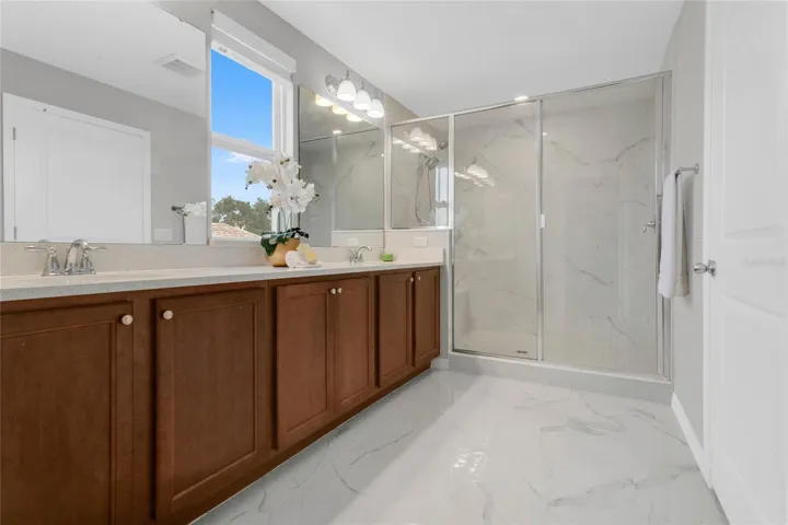Double vanity with quartz.