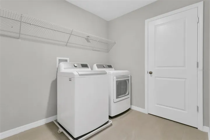 Upstairs Laundry complete with washer and dryer.
