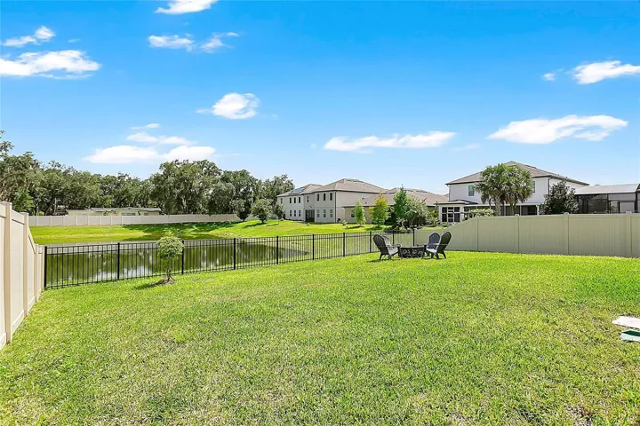 Backyard overlooks the neighborhood lake.