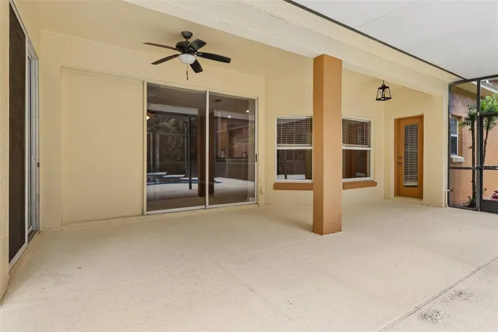 Sliding doors in the Living Room lead to the back patio and pool area.