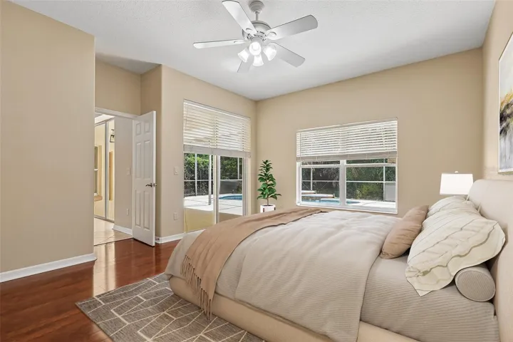 The spacious Primary Suite is a true private retreat, offering sliding glass doors to the lanai, dual closets—including a generous walk-in—and a SPA-INSPIRED EN SUITE BATH. Virtually Staged