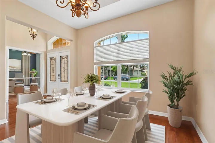 A formal Dining Room makes an elegant first impression with its ARCHITECTURAL TRAY CEILING and graceful arched entryway. Virtually Staged