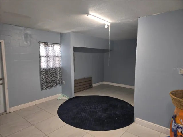 GARAGE CONVERTED TO GAME ROOM WITH SEPARATE ENTRANCE