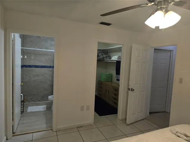 Master bath, closet and entrance to bedroom