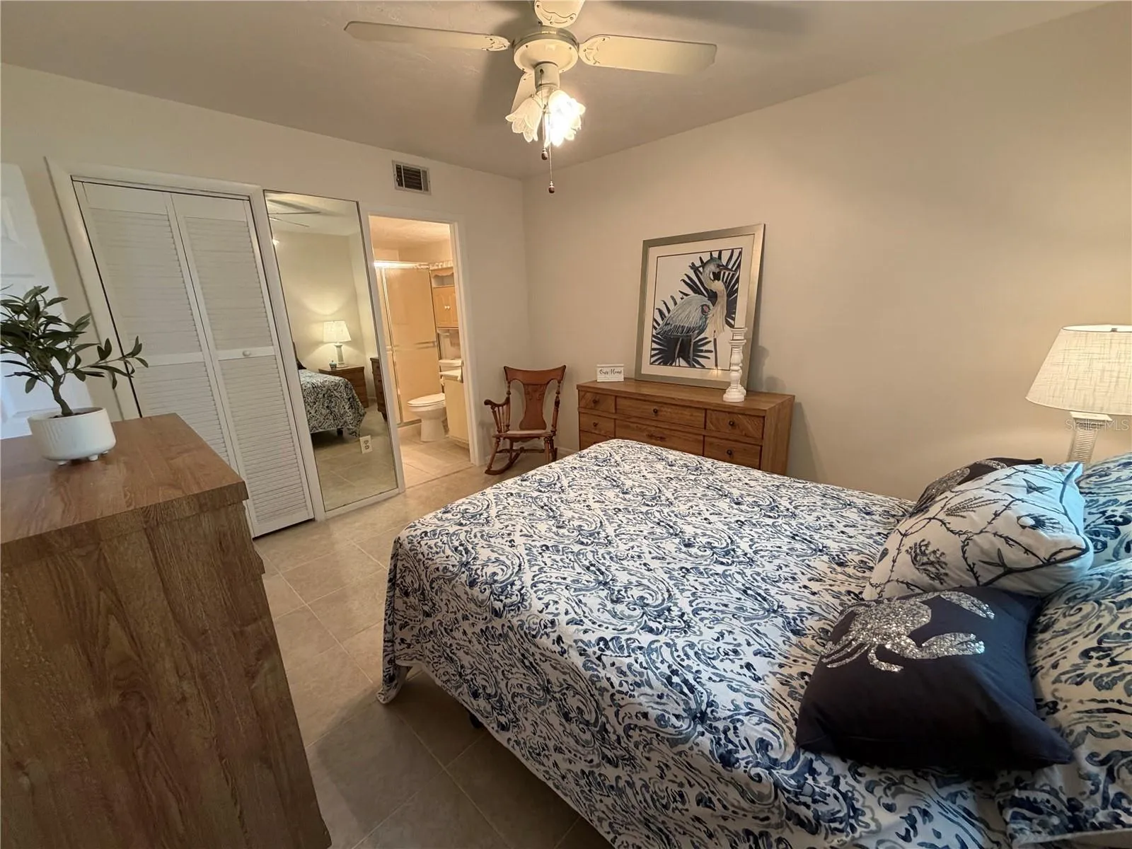 Primary Bedroom with En Suite, Walk-In Closet, Tile Flooring, Ceiling Fan