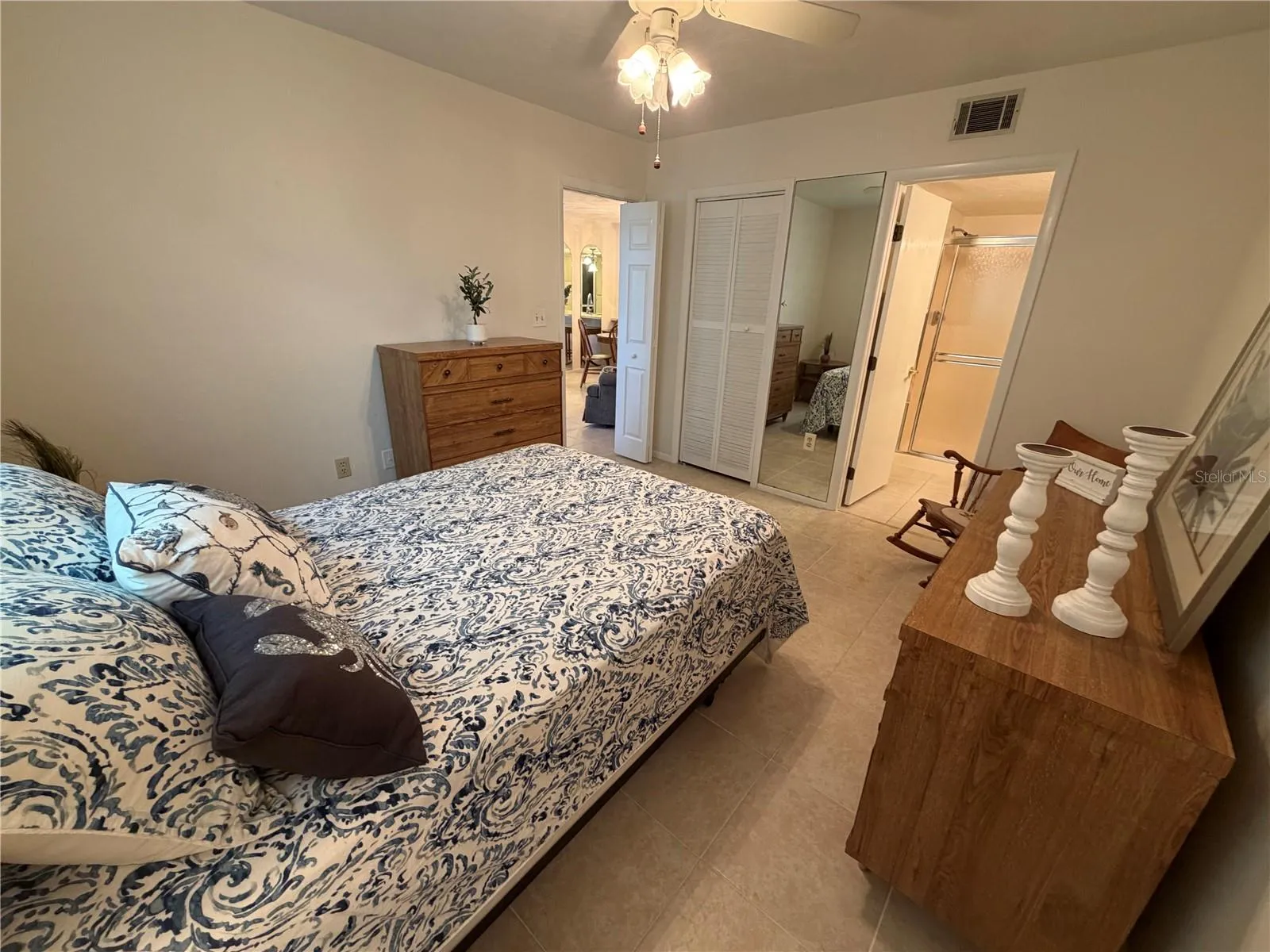 Primary Bedroom with En Suite, Walk-In Closet, Tile Flooring, Ceiling Fan