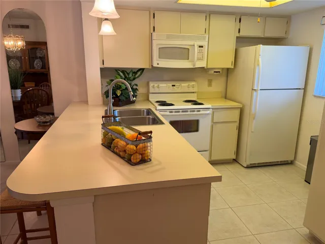 Kitchen with Breakfast Bar and Pantry