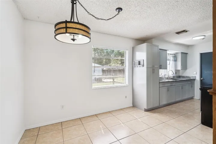 Dining Room with Peek of Kitchen