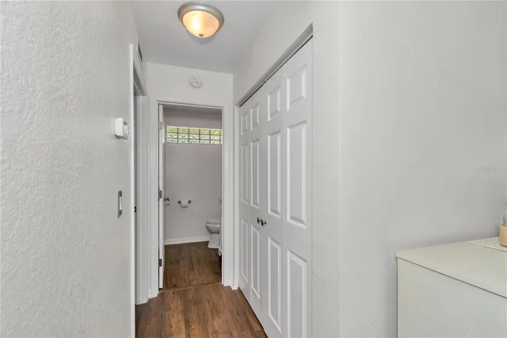 Looking into the half guest bath and additional large hall closet