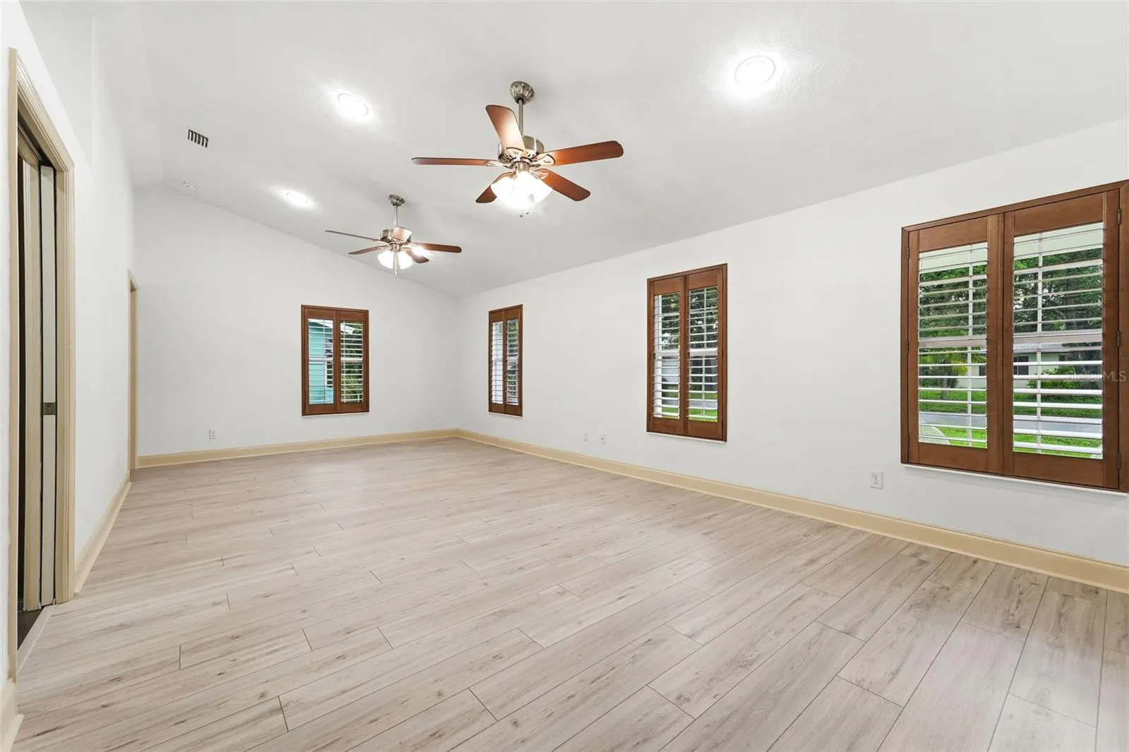 Vaulted ceilings and abundant natural light create an open, airy atmosphere.