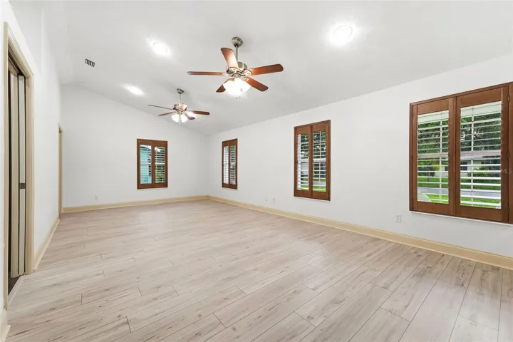 Vaulted ceilings and abundant natural light create an open, airy atmosphere.