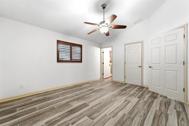 A spacious owner's suite filled with natural light and calming finishes.