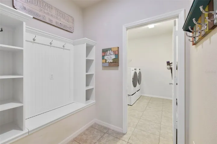 TO YOUR RIGHT IS THE MUDROOM AND LAUNDRY ROOM