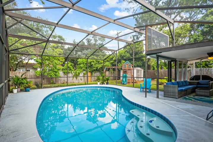 The screened in pool.