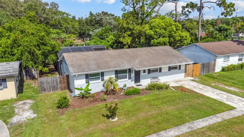 Front view of the pool home that is 3 bedrooms and 1 1/2 bathrooms.