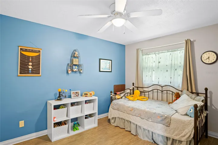 This bedroom is located off the family room and looks out to the back yard.